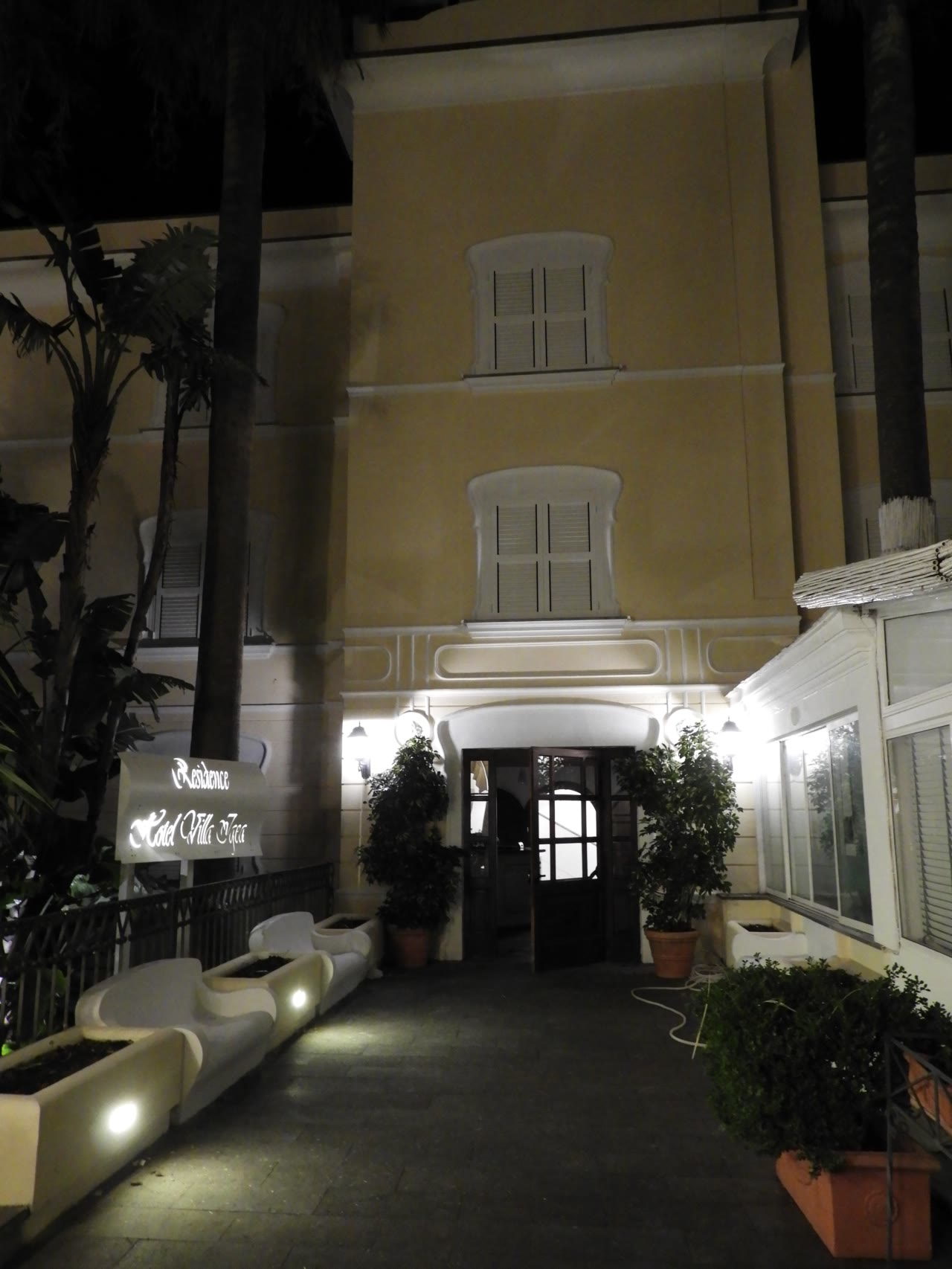 Illuminated entrance of Villa Igea